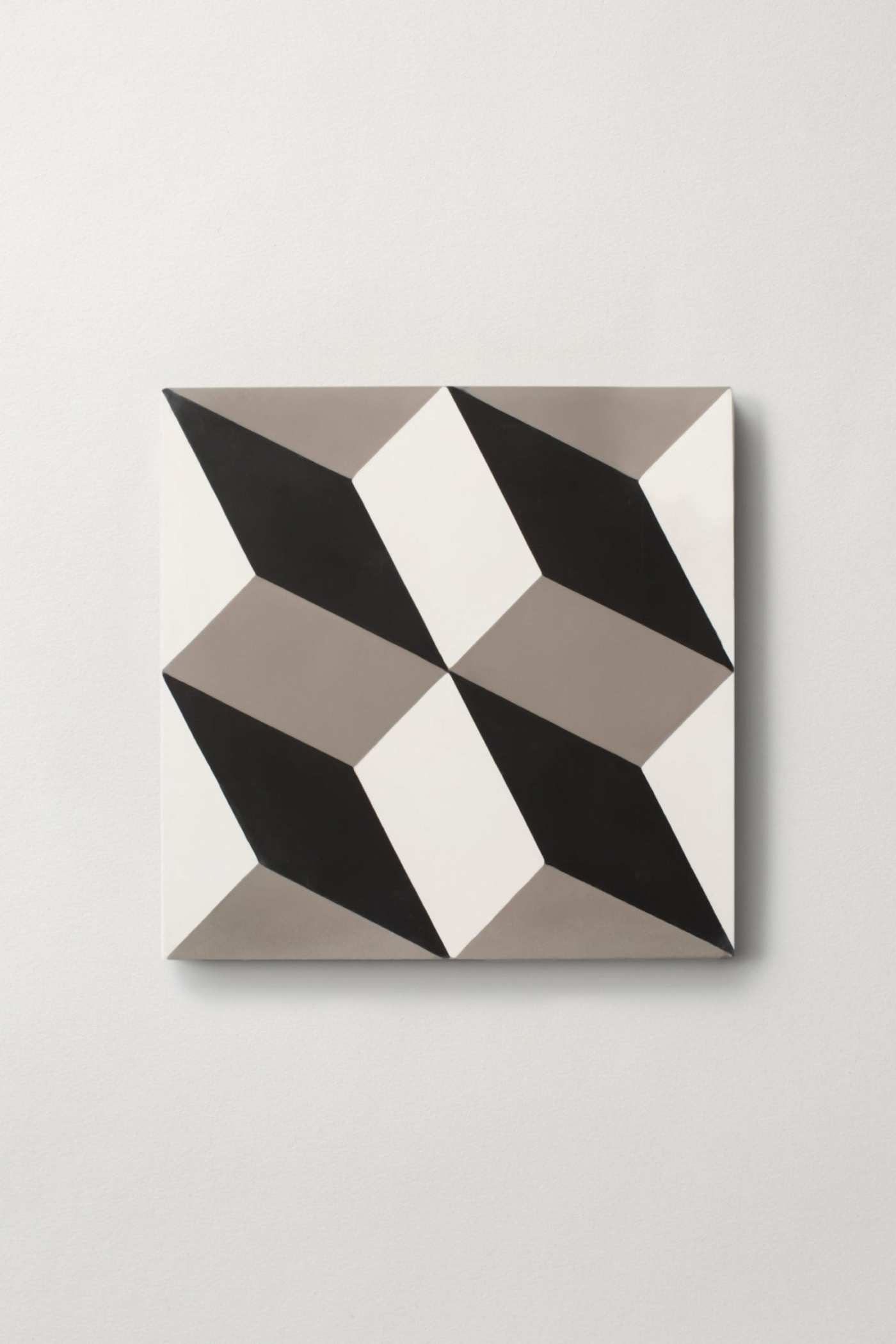 a black and white tile on a white surface.