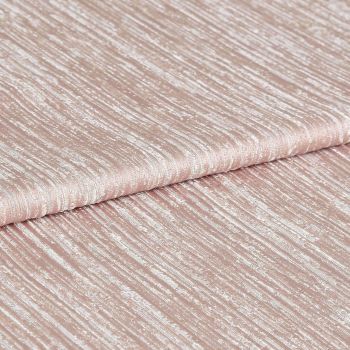 Shimmering, ribbed blush-pink fabric folded once, displaying horizontal crinkled texture and metallic sheen; close-up studio view with soft, even lighting emphasizing the tactile surface.