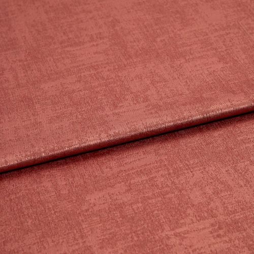 Folded rose‑colored textured fabric, a soft velvet-like material with a horizontal overlap fold; lit evenly in a close-up studio view showing subtle sheen and woven surface detail.