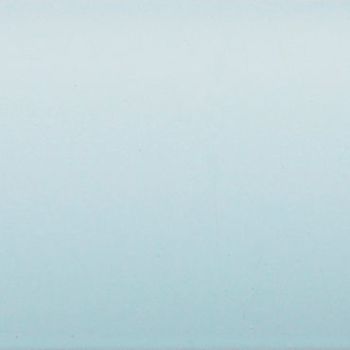 Pale blue painted wall occupying the frame, showing faint texture and a subtle vertical gradient, evenly lit and softly reflecting light in a minimal, featureless interior.