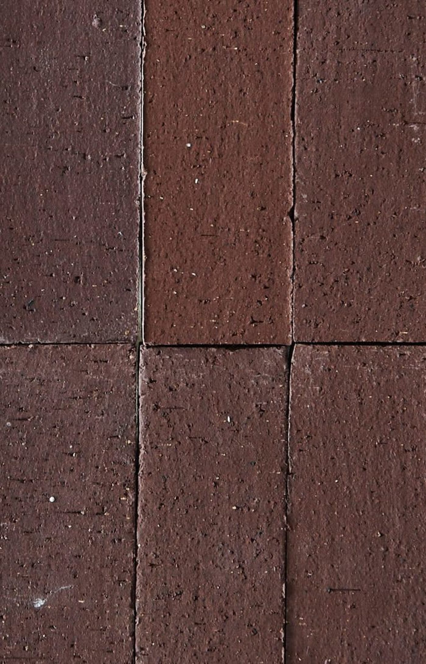 a close up image of a brown brick wall.