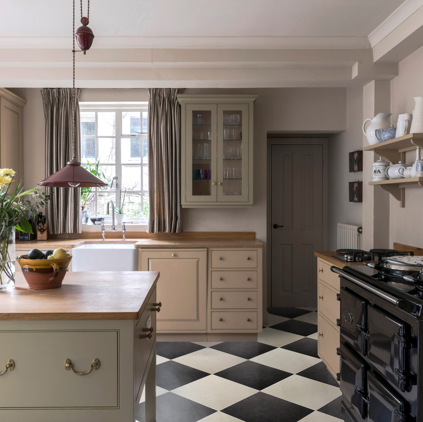 a kitchen with a black and white checkered floor.