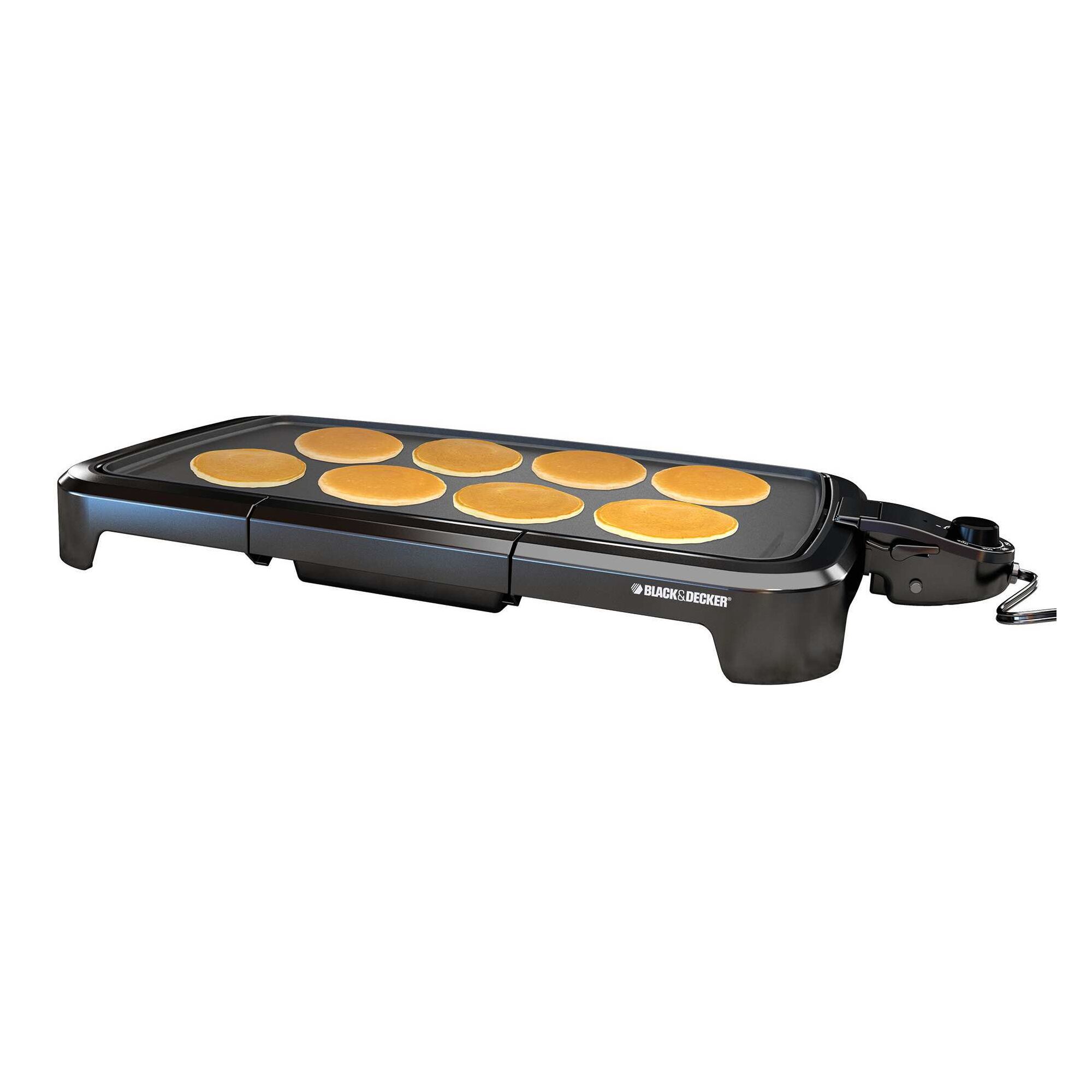 Family size electric griddle with pancakes.