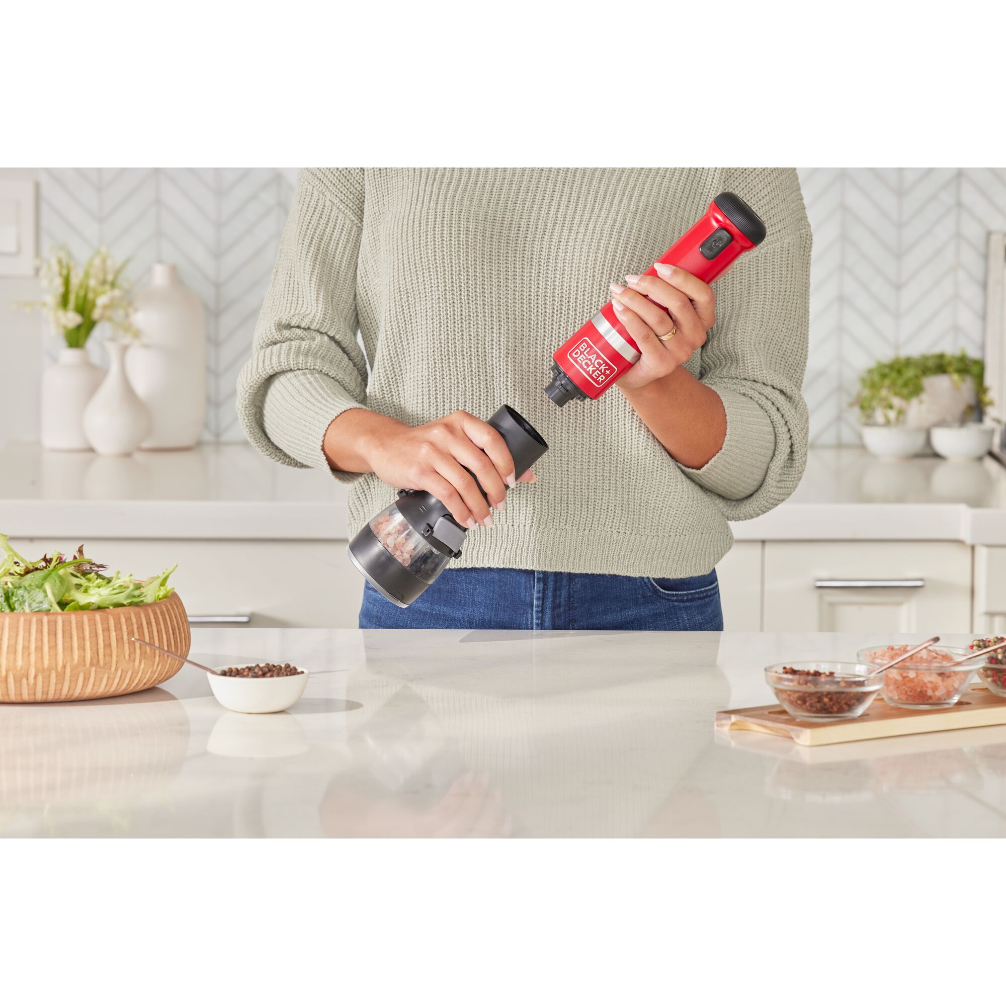 Talent showing how to attach the BLACK+DECKER kitchen wand spice grinder attachment to the red power unit