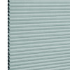 Light teal cellular (honeycomb) blind, fully lowered with visible hexagonal cells at left edge; horizontal pleats create uniform bands, blocking light in a close-up, evenly lit neutral background.