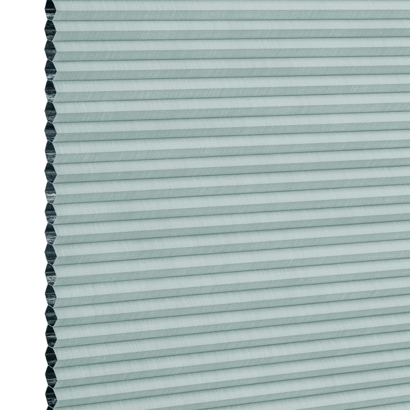 Light teal cellular (honeycomb) blind, fully lowered with visible hexagonal cells at left edge; horizontal pleats create uniform bands, blocking light in a close-up, evenly lit neutral background.