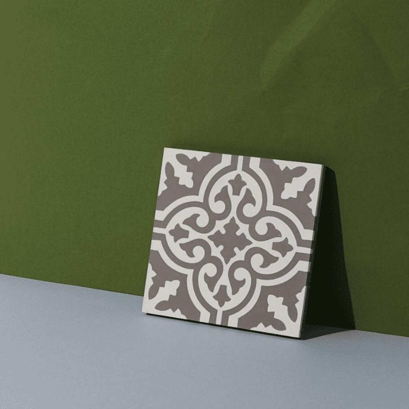 grey and white tile leaning on a green wall.