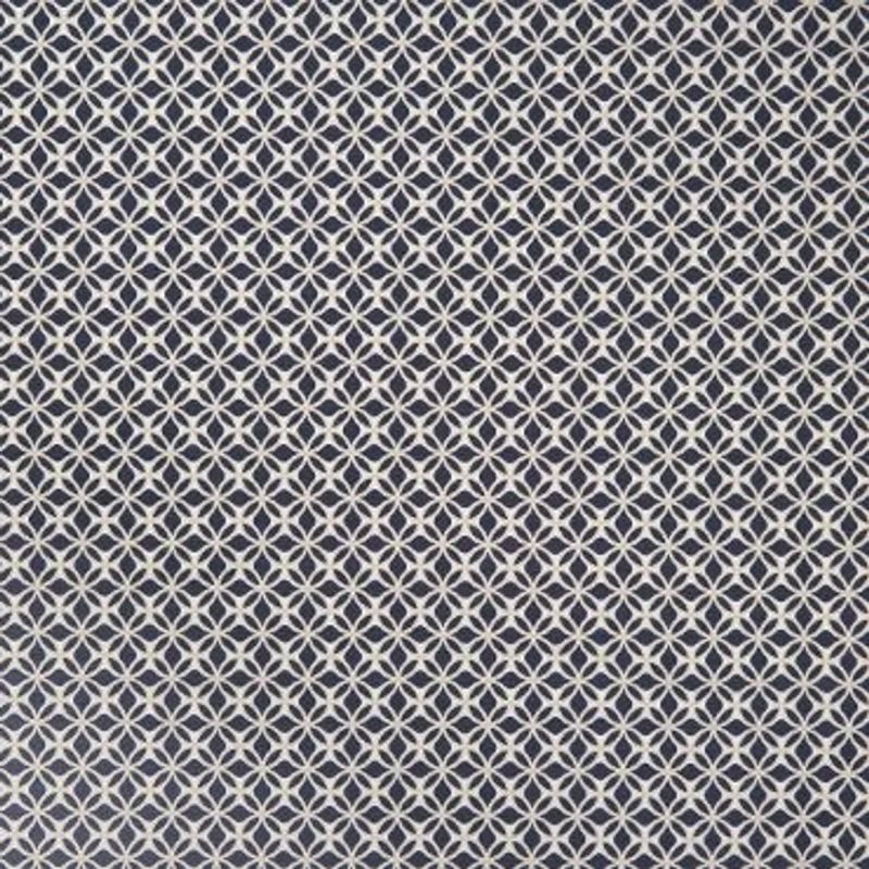 White interlocking circular-lattice pattern on navy fabric; repeating tessellated motif covering the entire surface; appears as flat wallpaper or upholstery in even, diffuse interior lighting.