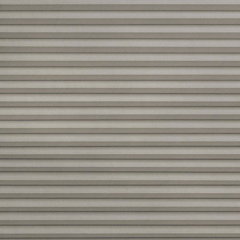 Horizontal pleated cellular blind, fully closed with evenly spaced fabric folds and subtle texture; blocking light and casting thin shadow lines; fills the frame in a neutral, softly lit interior.