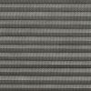 Grey pleated cellular blind, fully closed, narrow horizontal folds with perforated textured fabric; filtering light and covering a window in a softly lit interior, no visible view.