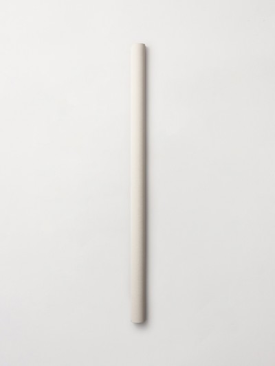 a long white tube sitting on a white surface.