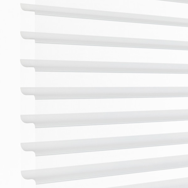 White horizontal sheer zebra blinds mounted over a window, alternating opaque and translucent bands; partially closed, filtering bright daylight into a minimal, evenly lit interior.