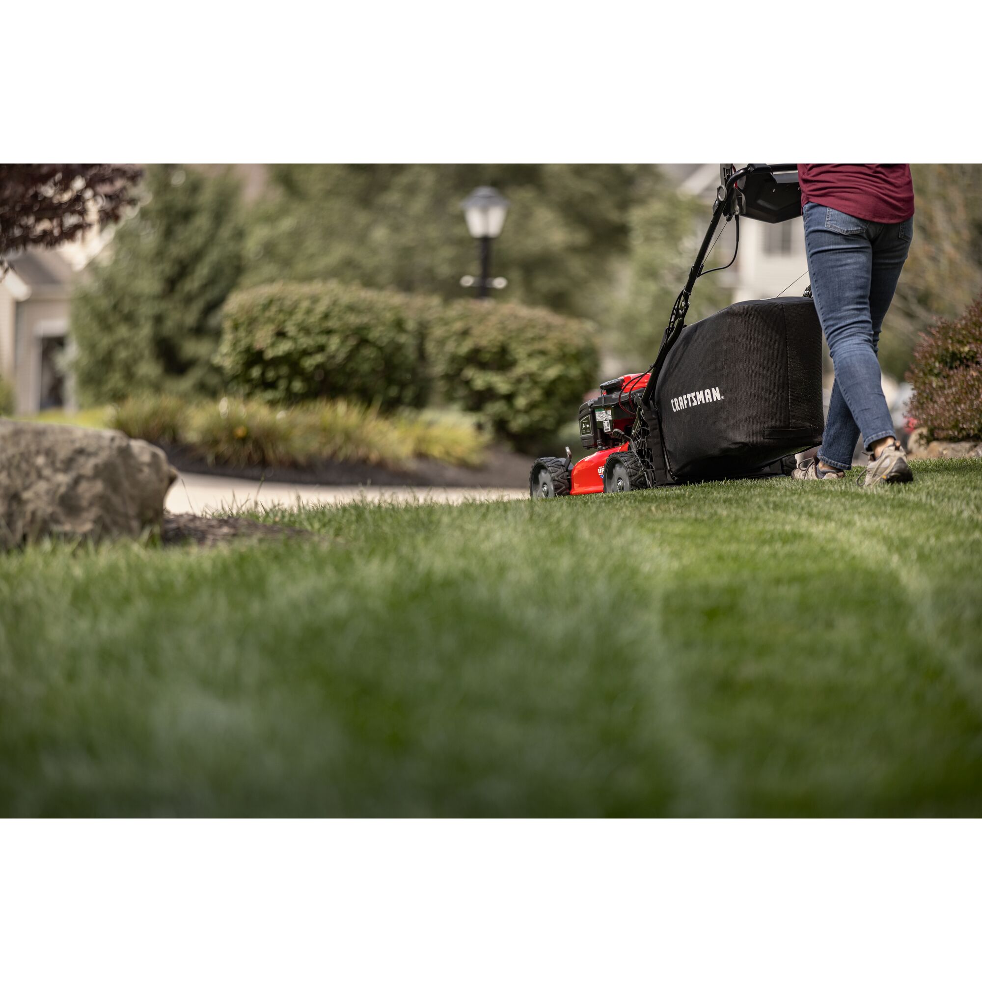 CRAFTSMAN M310 Gas Push Mower close to ground angle mowing grass in yard