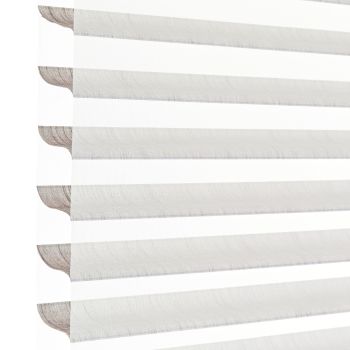 Sheer zebra roller blinds with alternating opaque and translucent horizontal bands, lowered to filter and diffuse bright daylight, shown close-up against a plain white background in soft light.