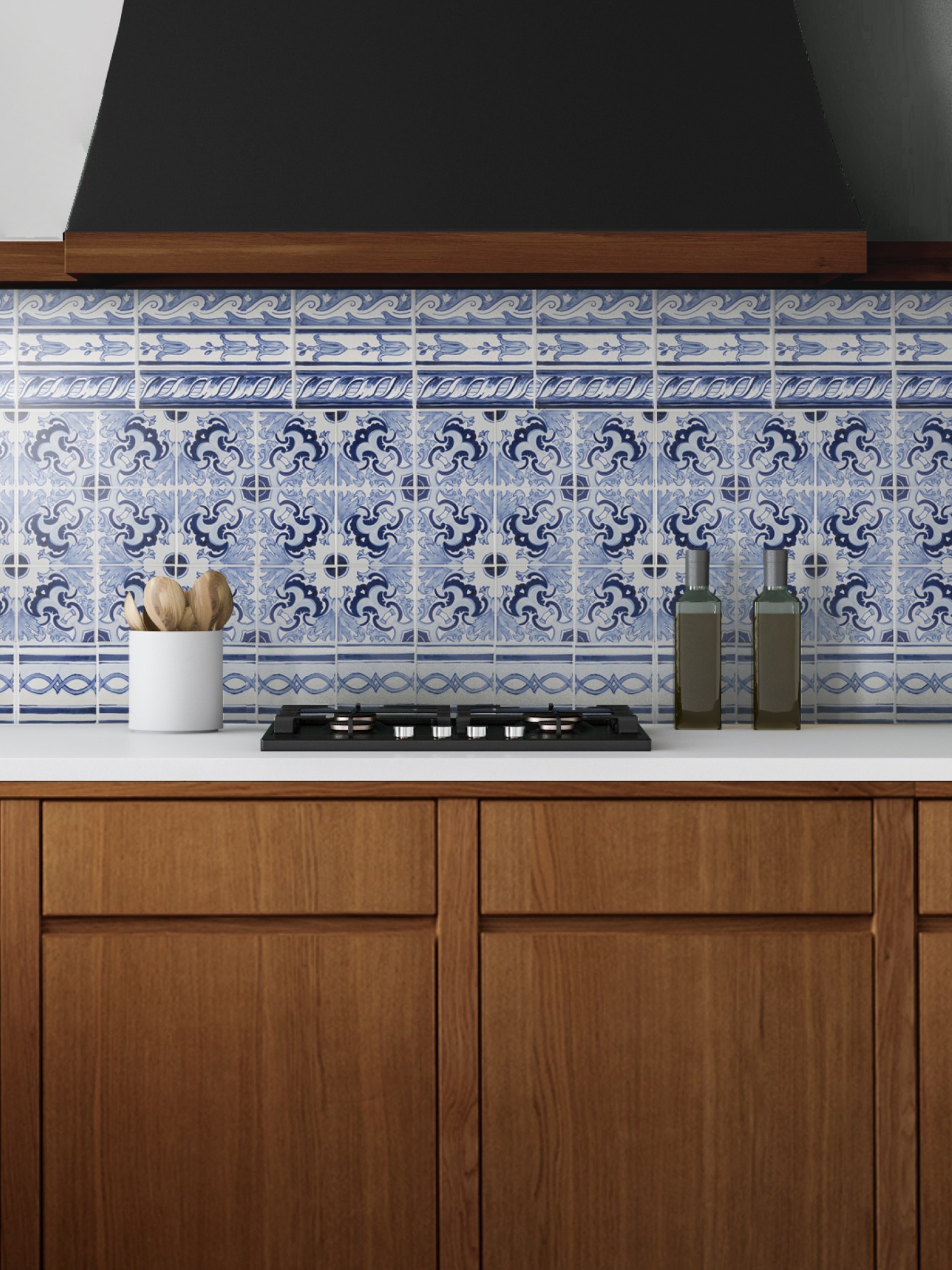 a blue and white tiled backsplash in a kitchen.