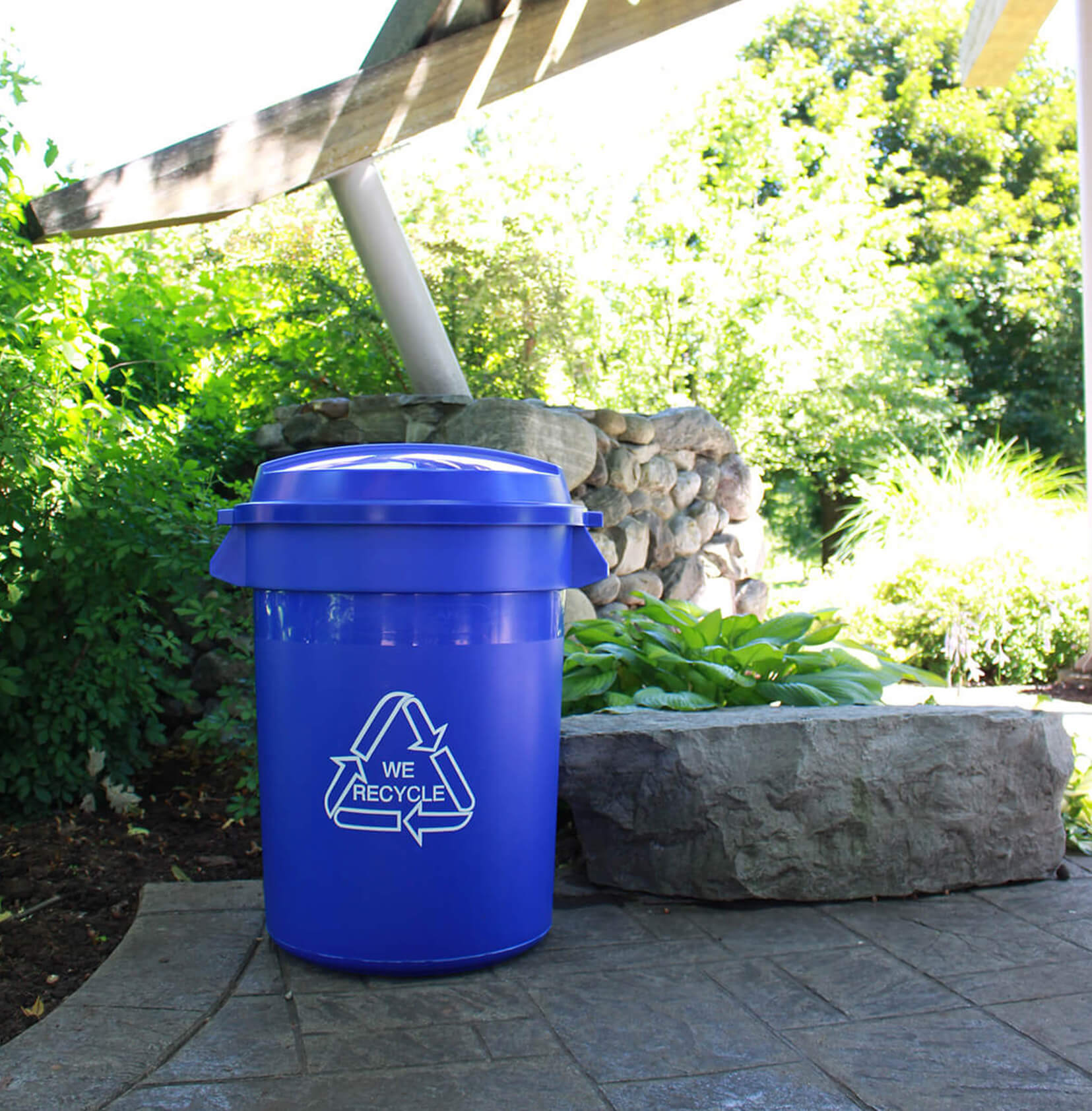 blue body with blue lid recycling bin at a town park