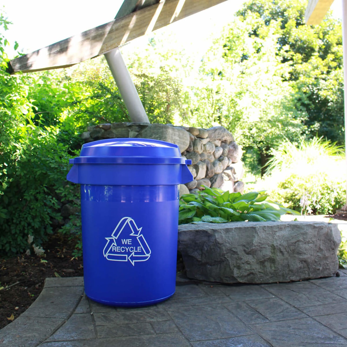 blue body with blue lid recycling bin at a town park