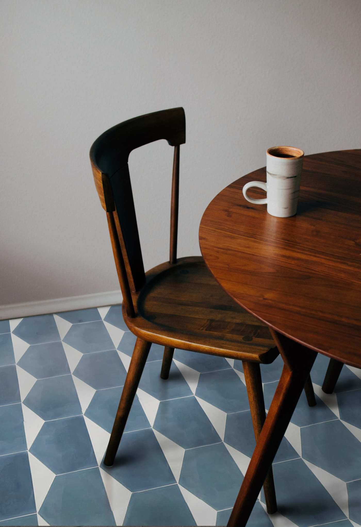 a wooden table with a cup of coffee on it.