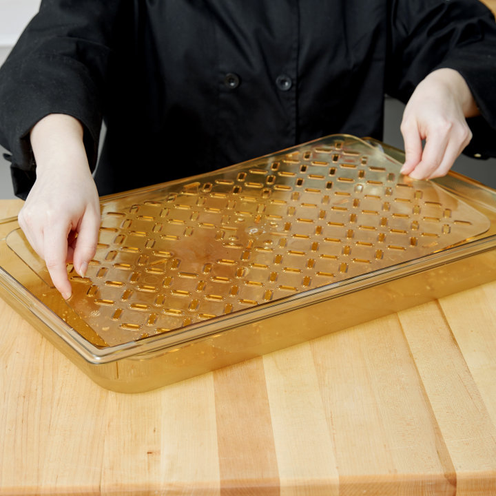 Full-size Super Pan® high-temperature plastic false bottom in amber