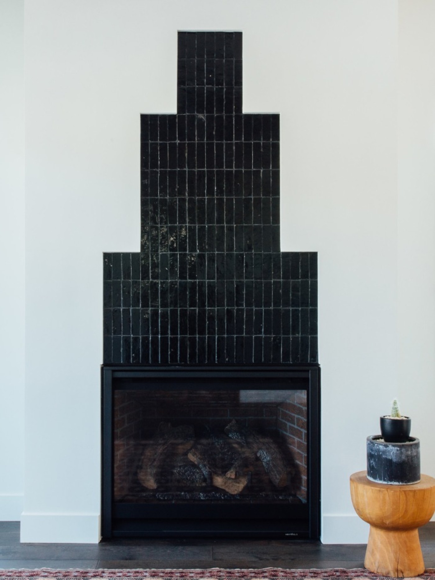 a black tiled fireplace.