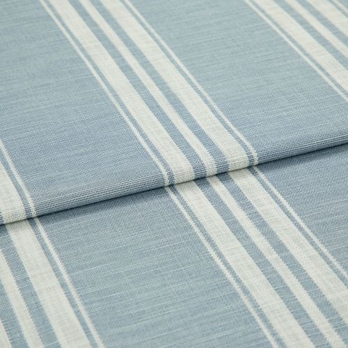 Blue-and-white striped woven fabric (curtain sample) folded into layers; vertical white stripe bands on pale blue ground, textured weave visible, close-up on flat surface under soft, even lighting.