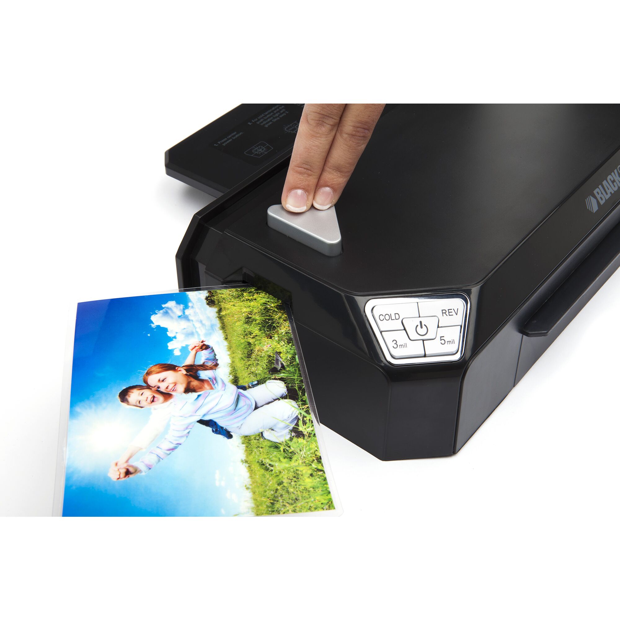 Flash Pro 9.5 inch thermal laminator being used by a person to laminate a photograph.