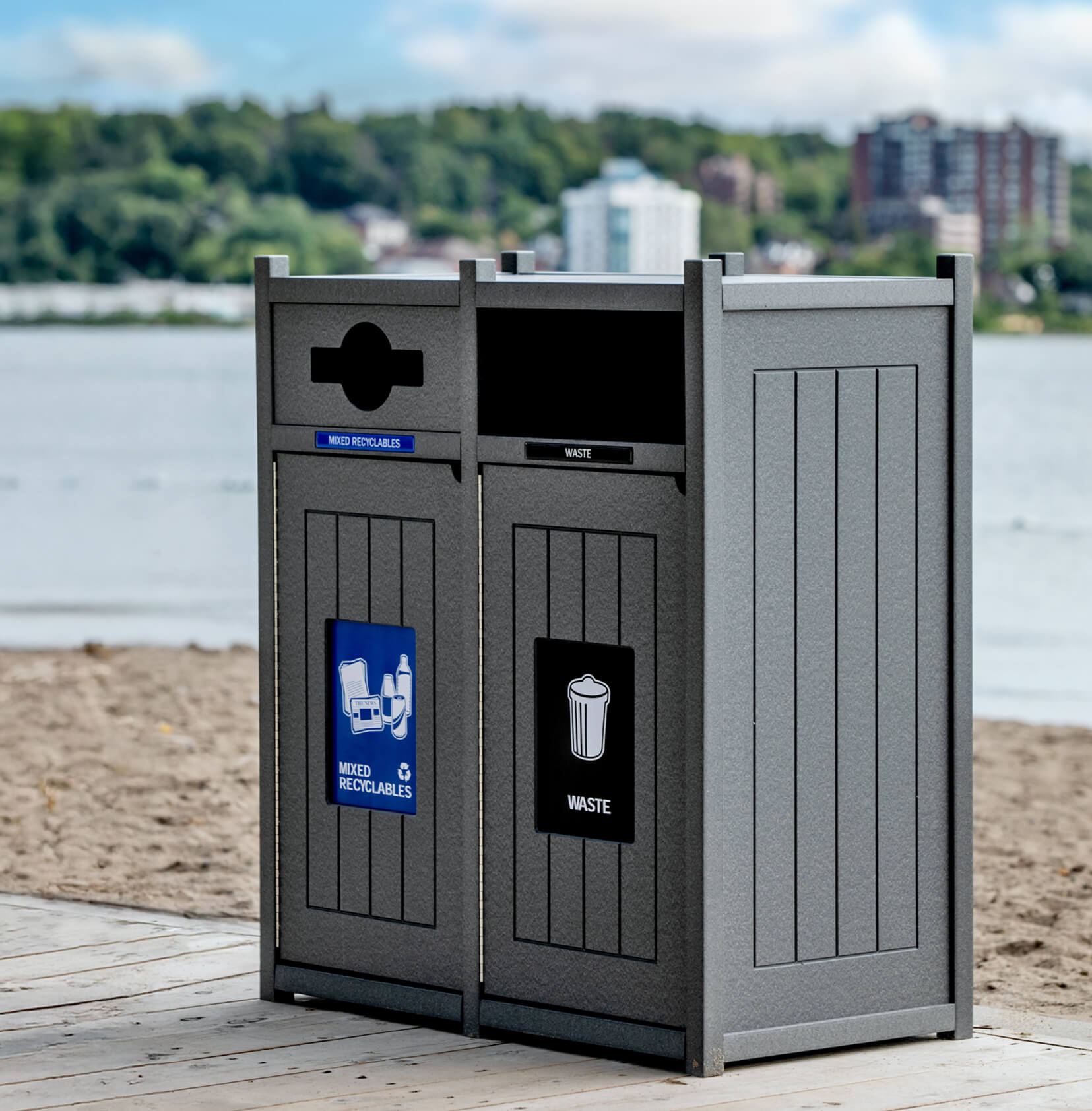 grey recycled plastic lumber double recyclables and trash container on a community boardwalk at the beach