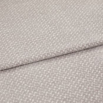 Light gray textured fabric with a small raised pebble pattern, layered in two overlapping folds; fabric lies flat with a slightly raised seam; close-up studio shot with soft, even lighting.
