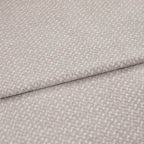 Light gray textured fabric with a small raised pebble pattern, layered in two overlapping folds; fabric lies flat with a slightly raised seam; close-up studio shot with soft, even lighting.