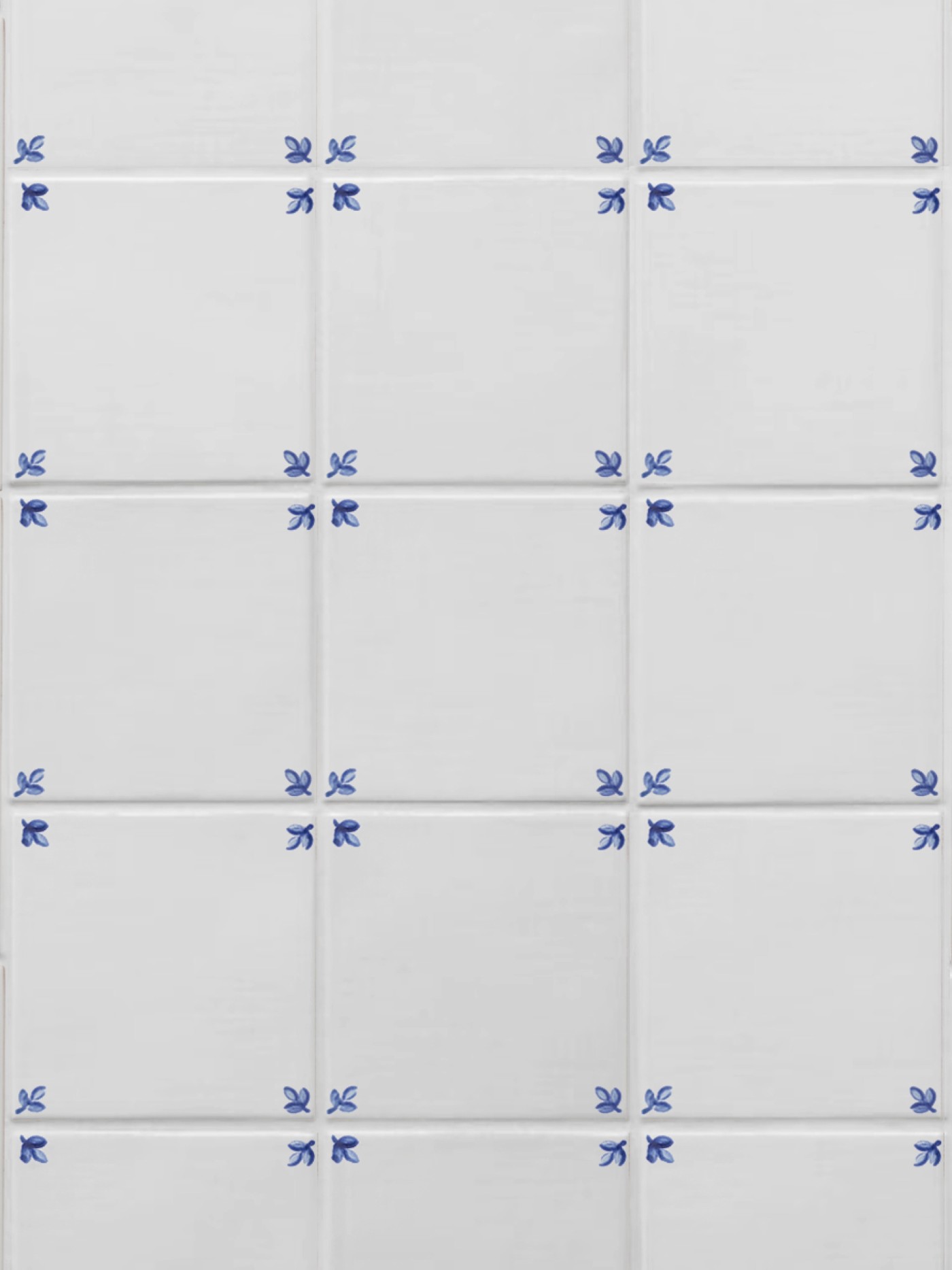 white tiles with blue designs on the corners.