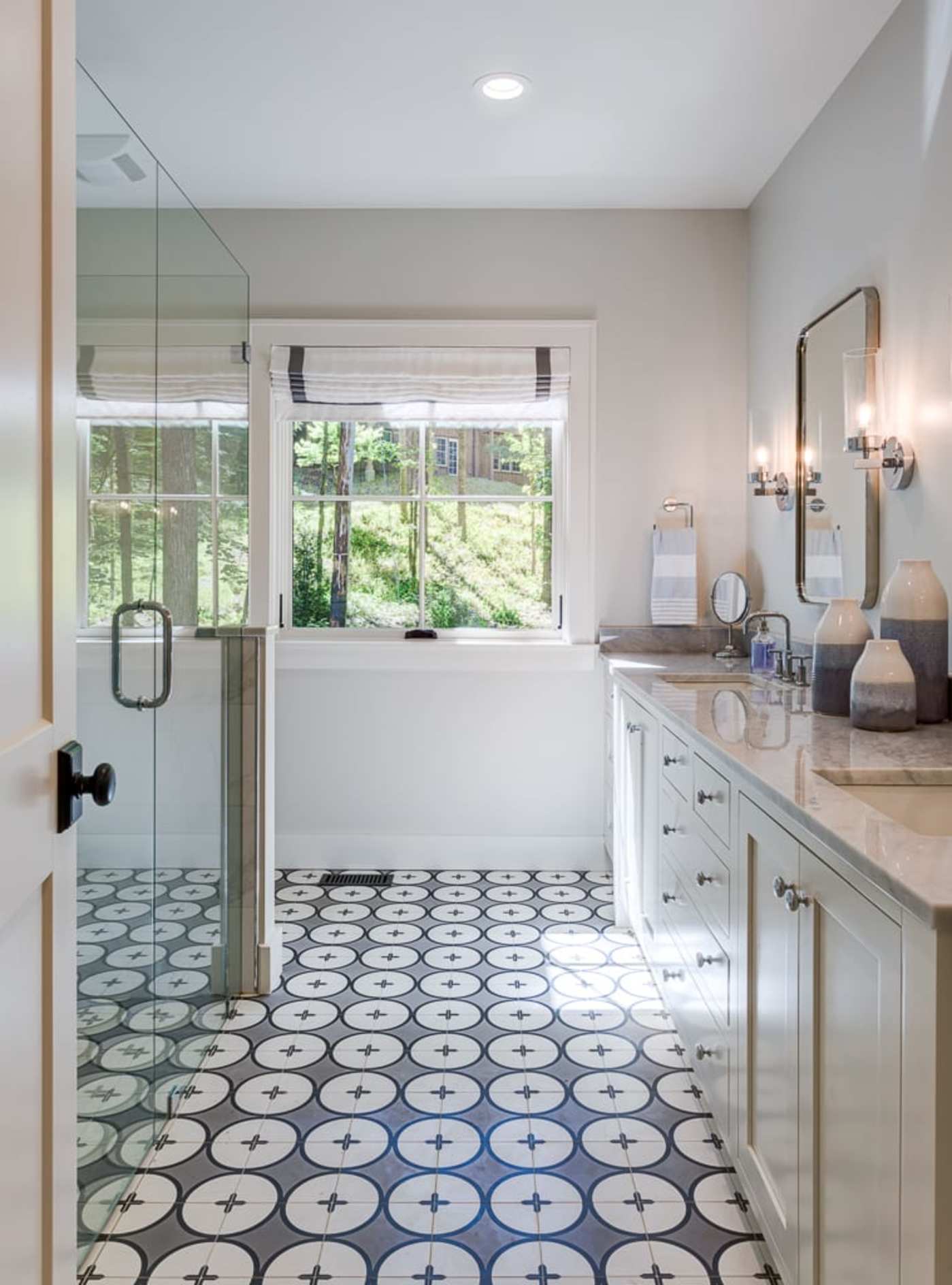 a bathroom with a black and white tile floor.