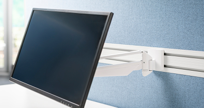 Lift a monitor off the desk surface to maximize space.