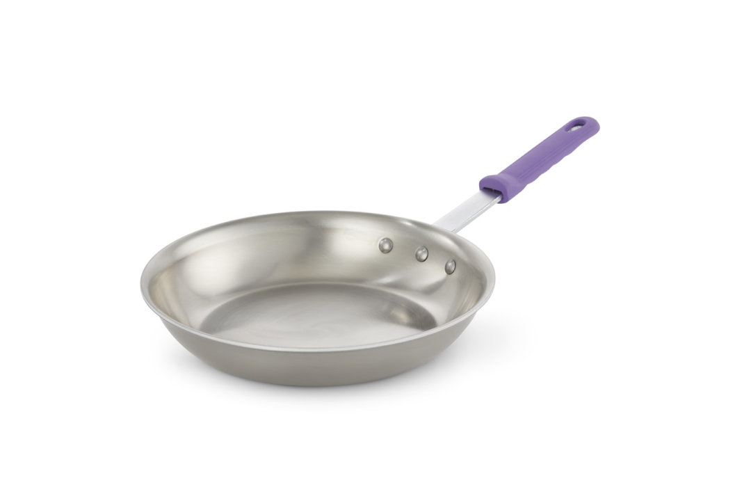 10-inch Tribute® 3-ply frying pan in natural finish with purple silicone handle