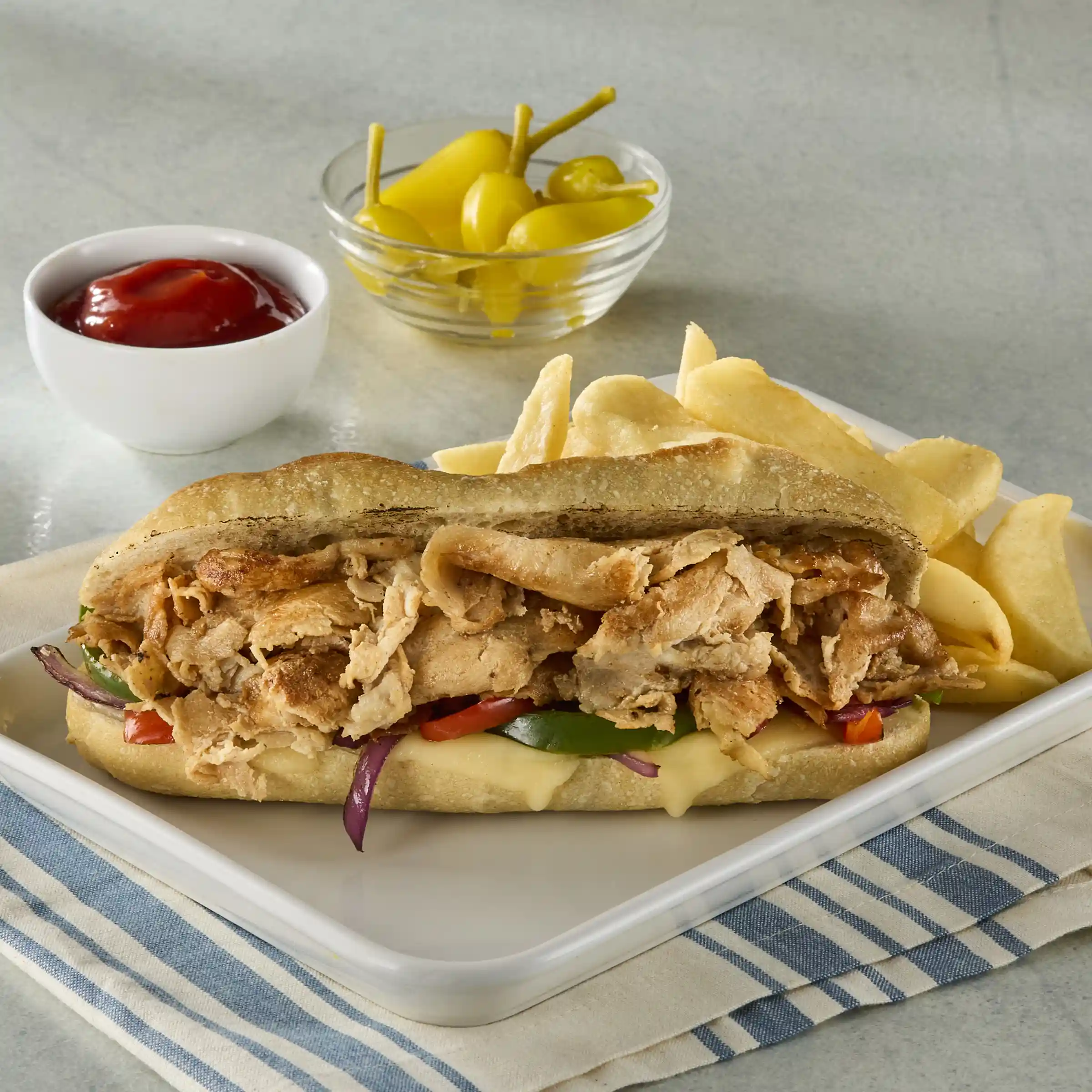 Original Philly® Chicken Sandwich Slices https://images.salsify.com/image/upload/s--fxh4LmUQ--/q_25/c58822bafac8b4e40a7304f4f874915d4f0eb87e.webp