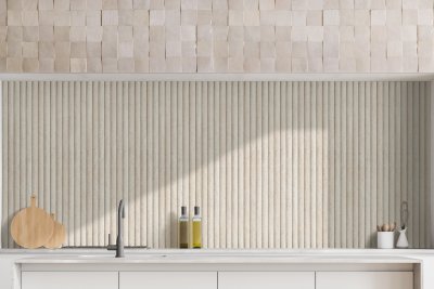 a white kitchen with a wooden counter top.
