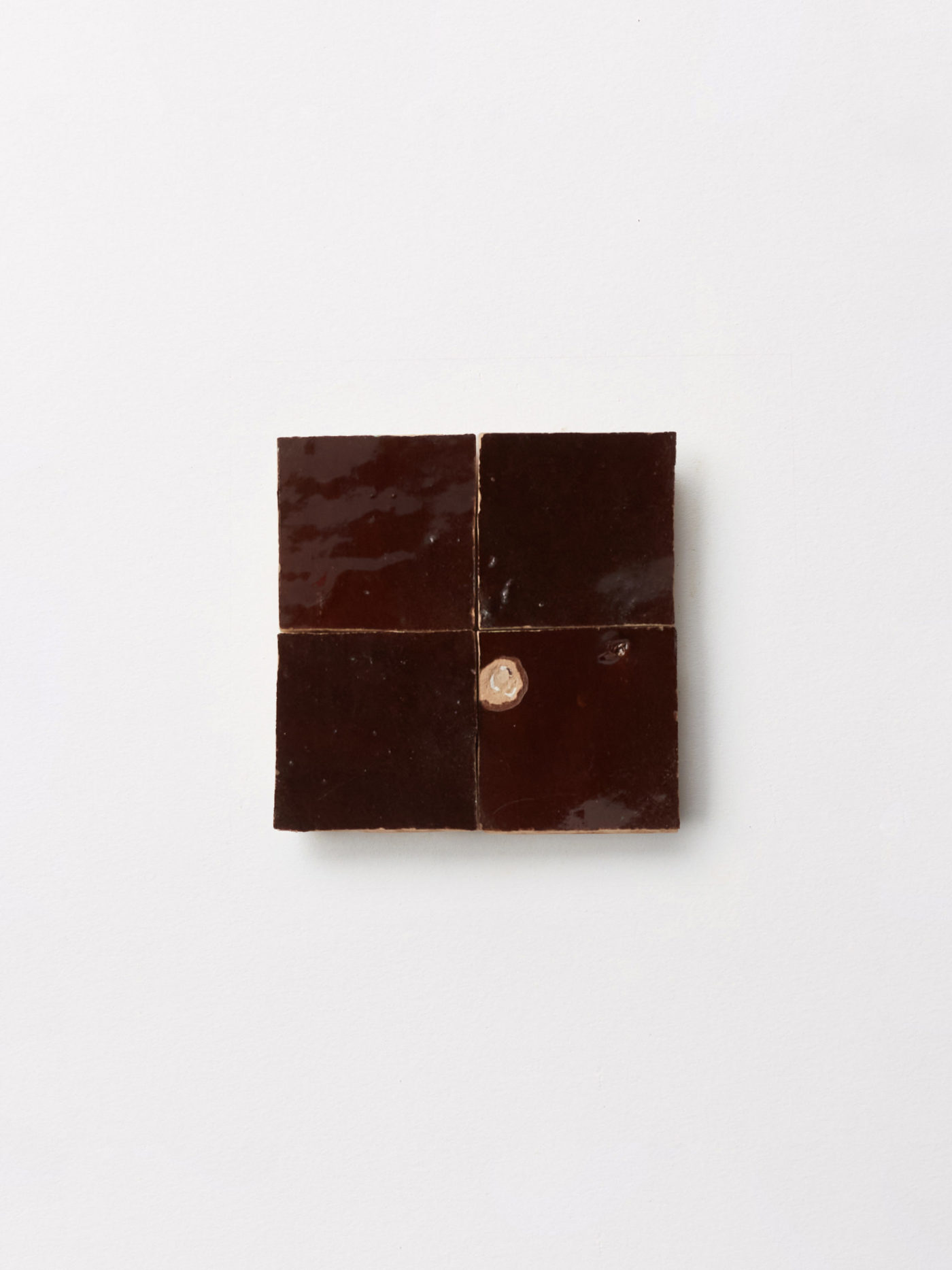 4 square piece of tile on a white background.