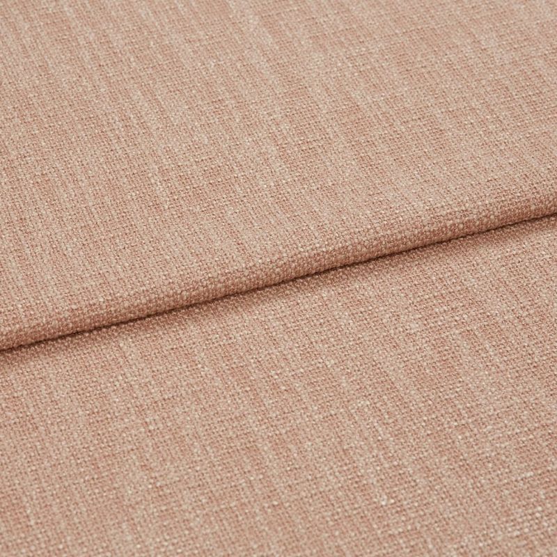 Blush-pink woven fabric folded over itself, showing a coarse textured weave; close-up studio view with soft, even lighting highlighting fibers.