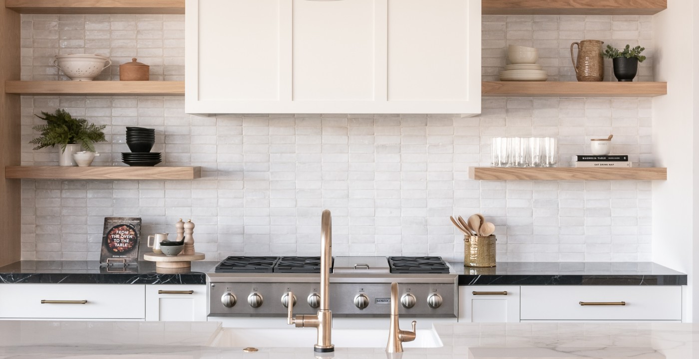 a kitchen with white tile backsplash.