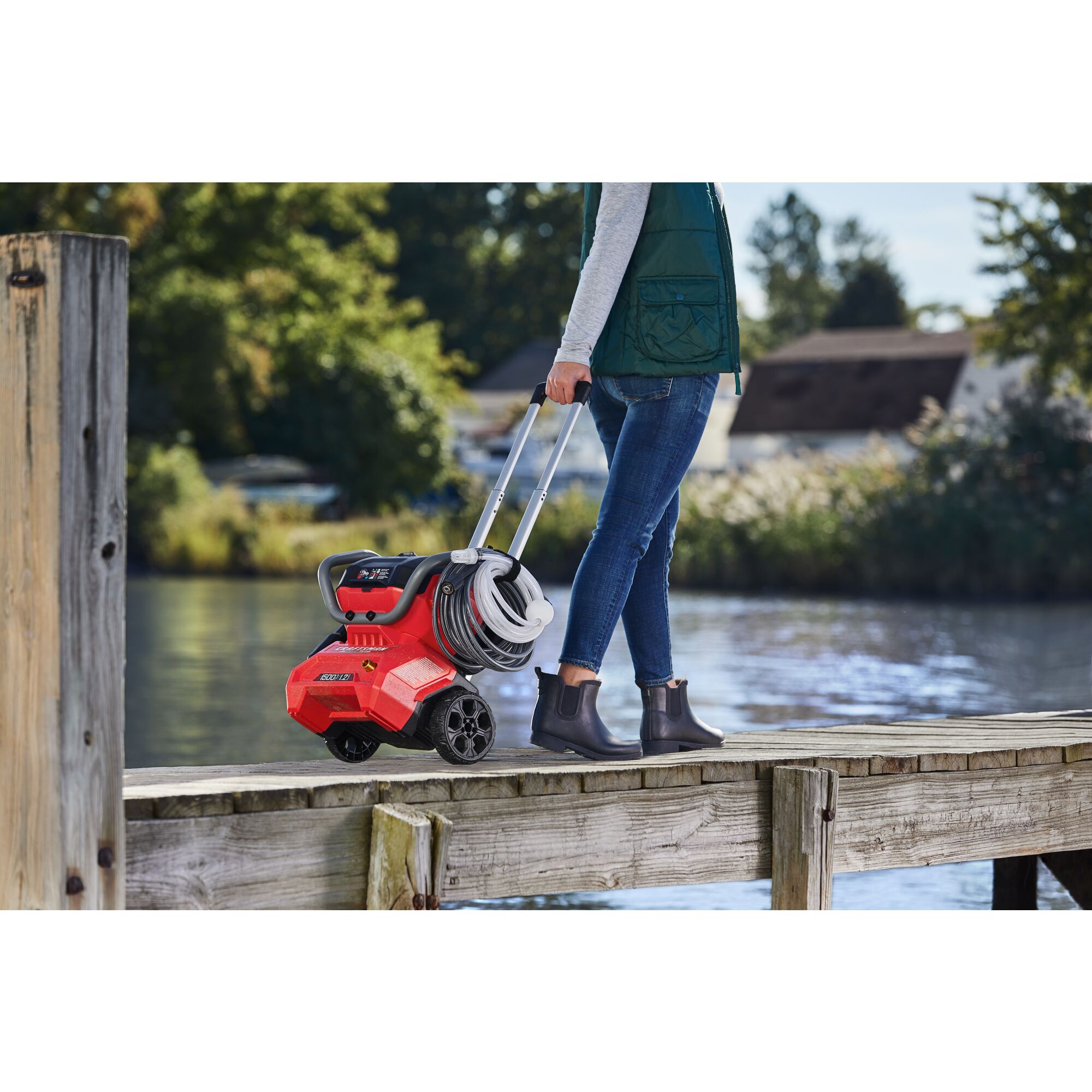 CRAFTSMAN 1500 PSI Pressure Washer being wheeled on pier by female