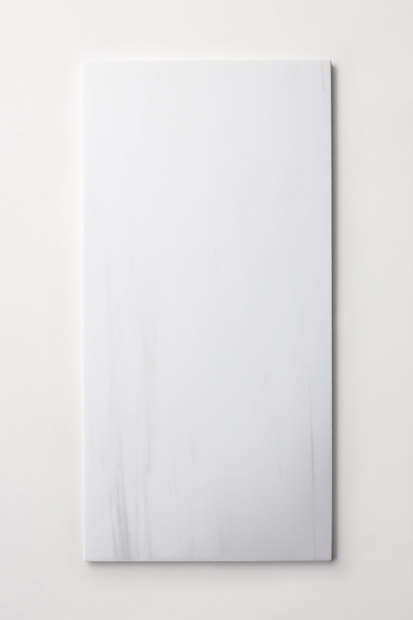 a white rectangle tile on a white background.