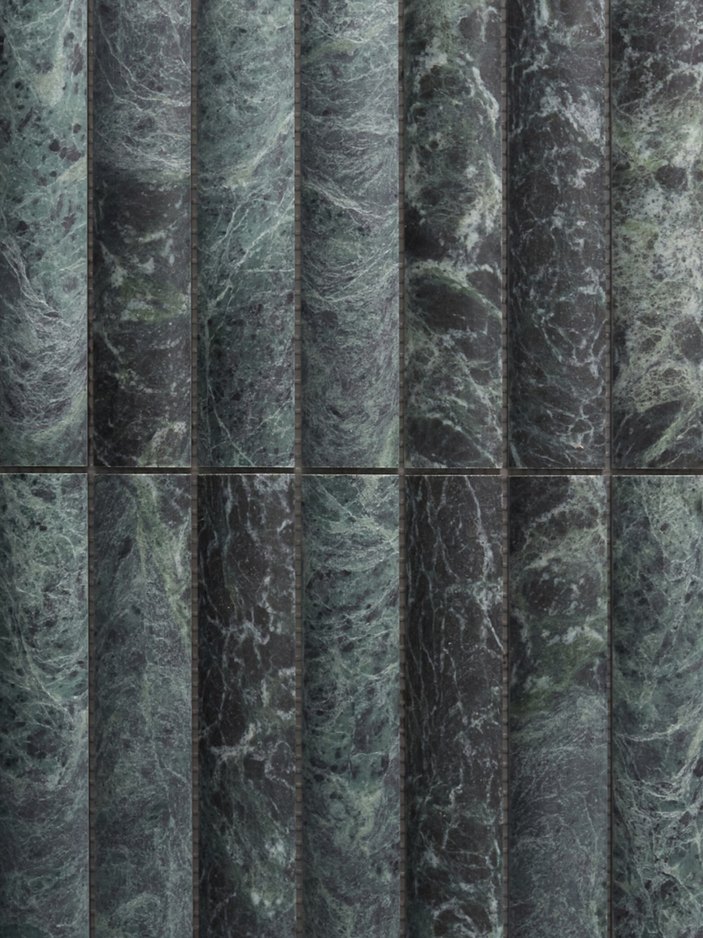 a row of green marble tiles.