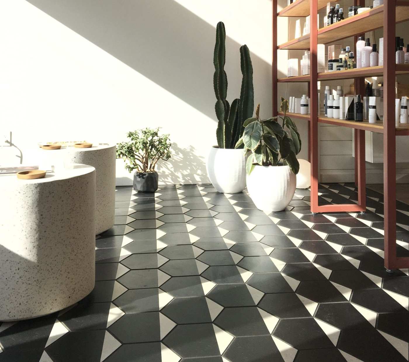 a bathroom with a black and white tile floor.