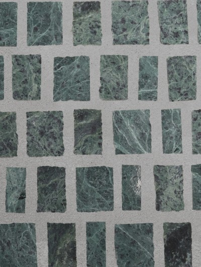 a green marble tile with squares on it.