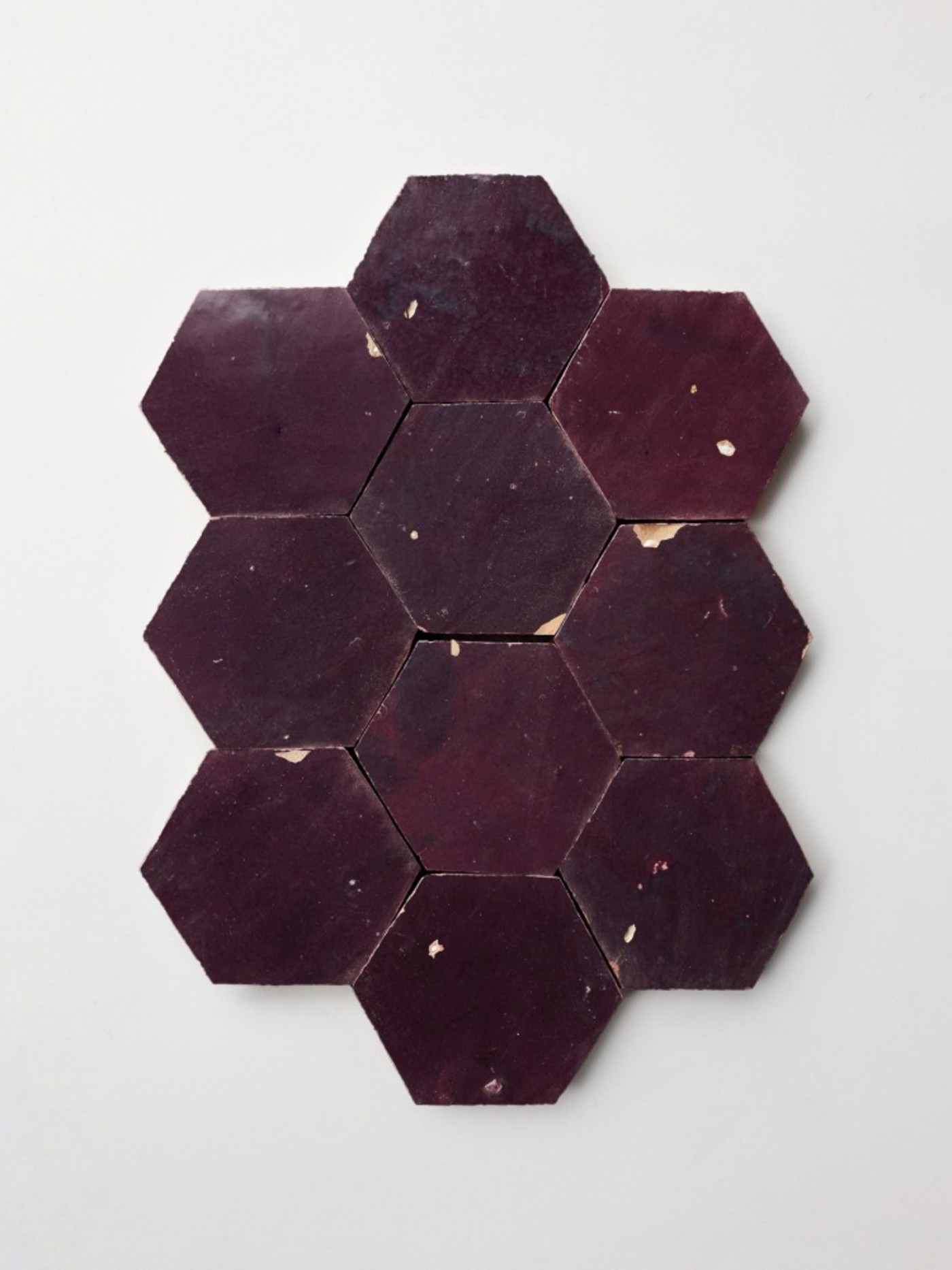 a set of purple hexagon tiles on a white surface.