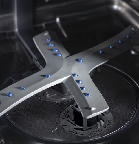 Reversing quad blade wash arm