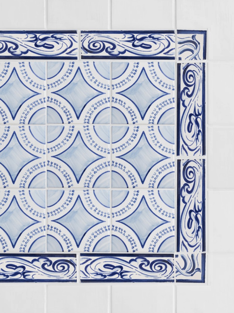 blue and white tiles with designs on them.