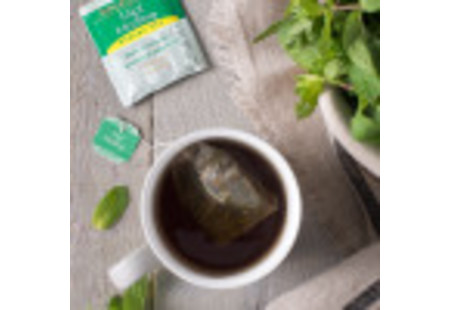 Lifestyle image of a cup of Bigelow Mint Medley Herbal Tea