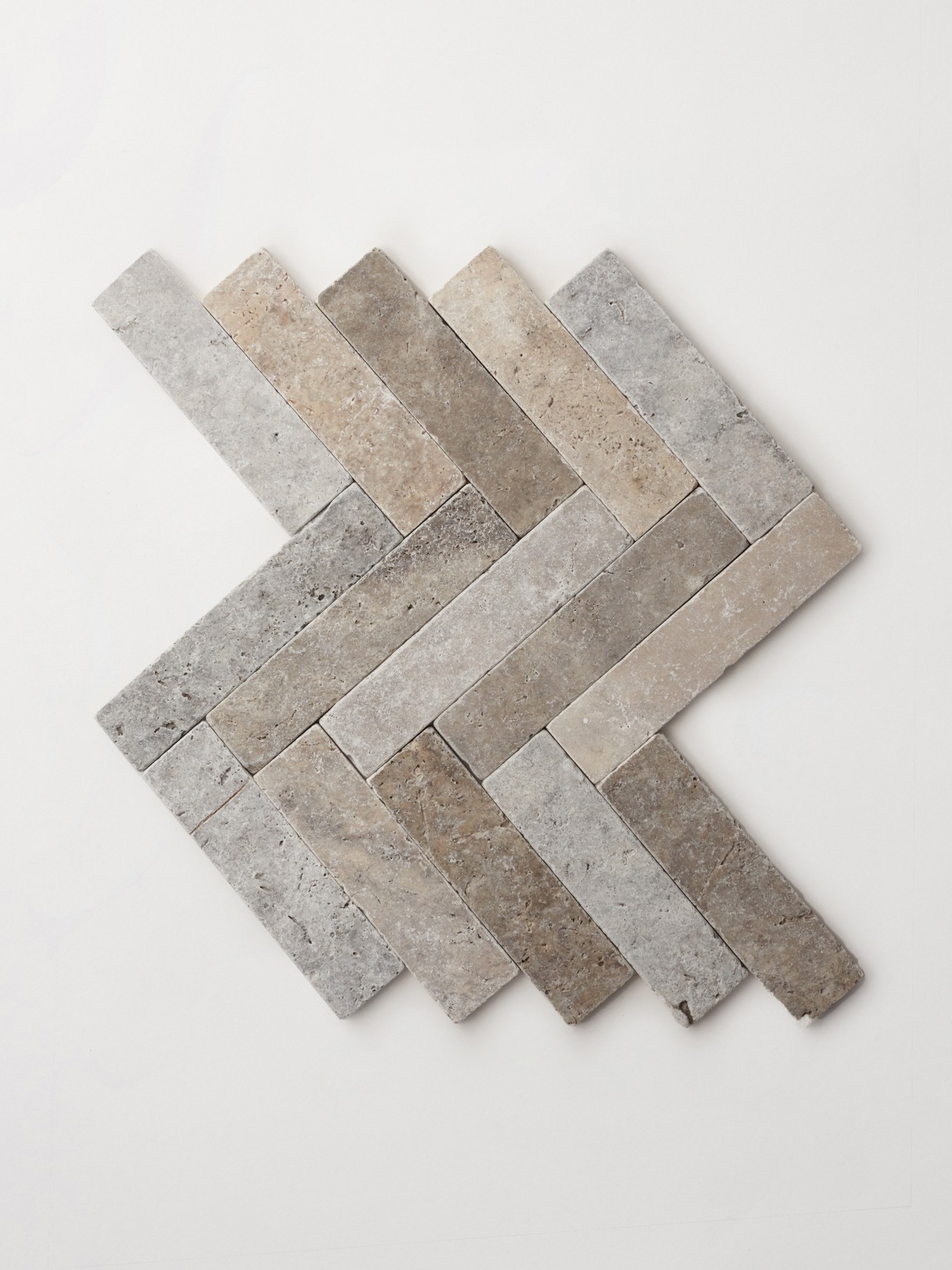 herringbone tile on a white surface.