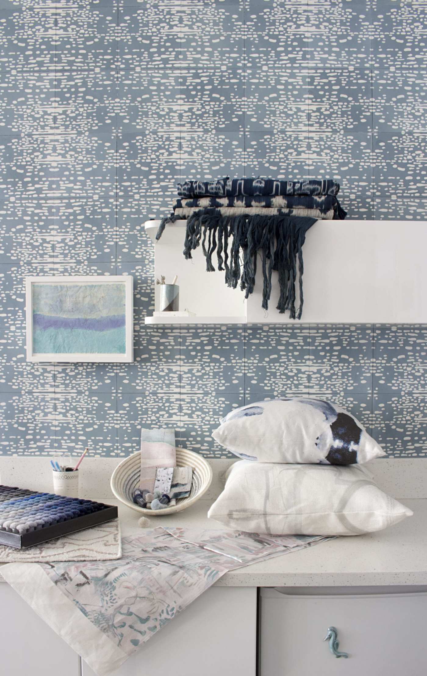 a room with a blue and white patterned tile walls.