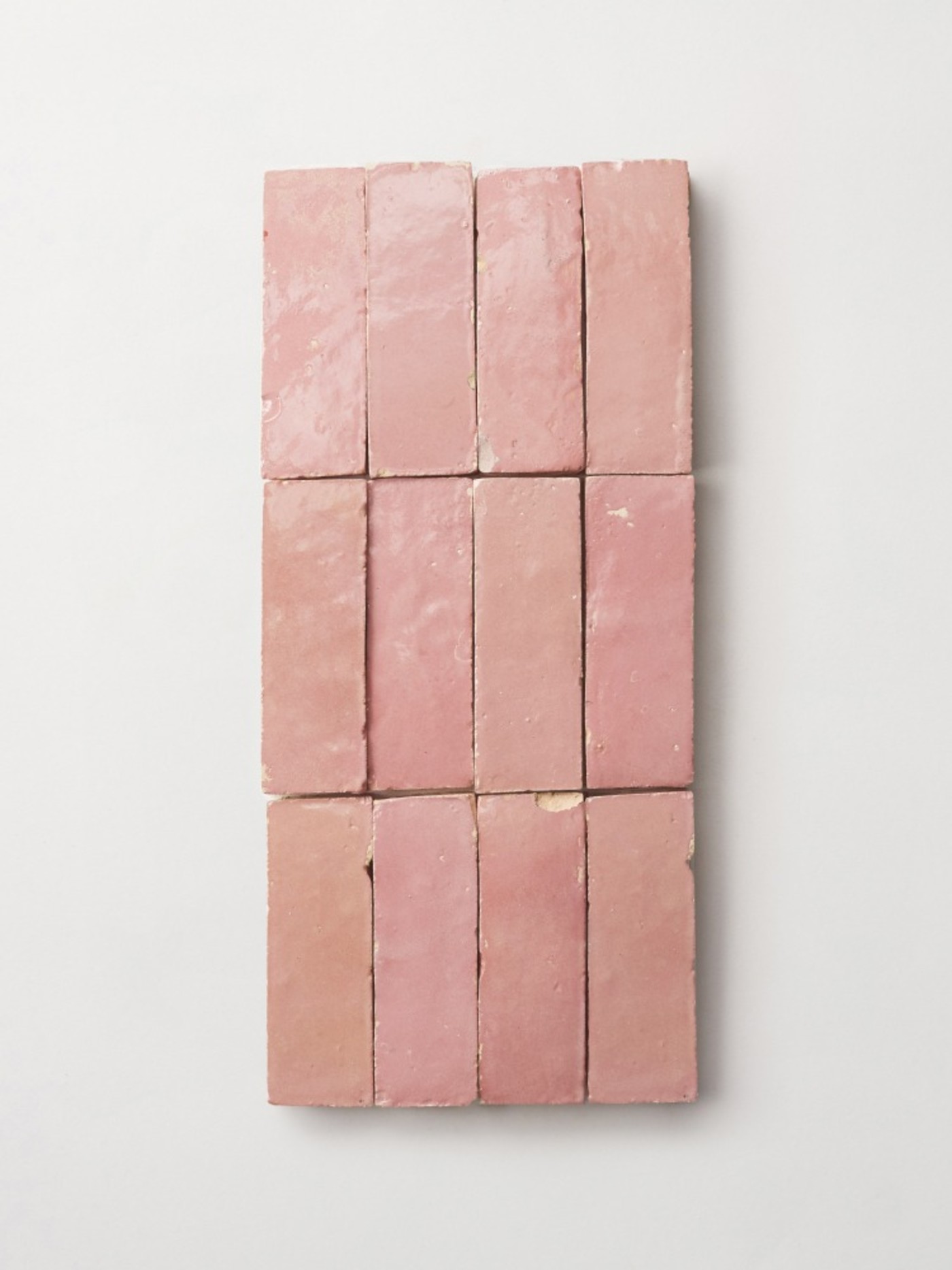 pink tiles arranged on a white background.